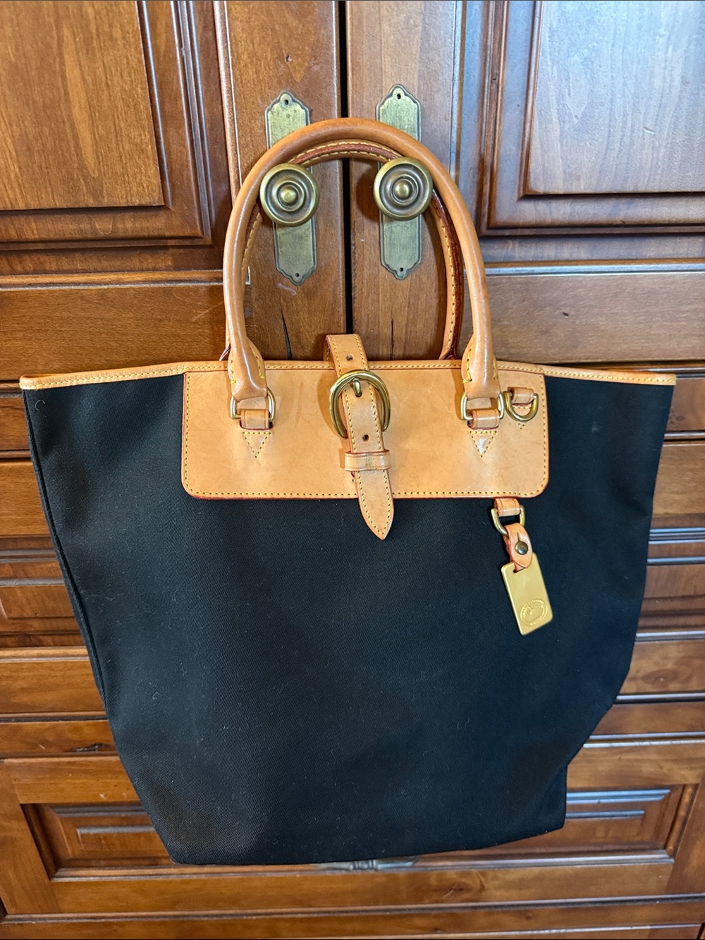Dooney & Bourke Black Tote with Tan Leather Trim and Gold Hardware